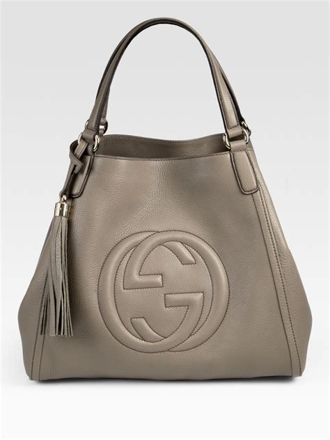 taylor hall gucci purse 